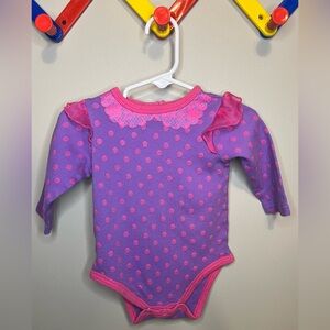 Size 9 months 2010 Baby Essentials Purple Bodysuit
Long sleeve pink swirls